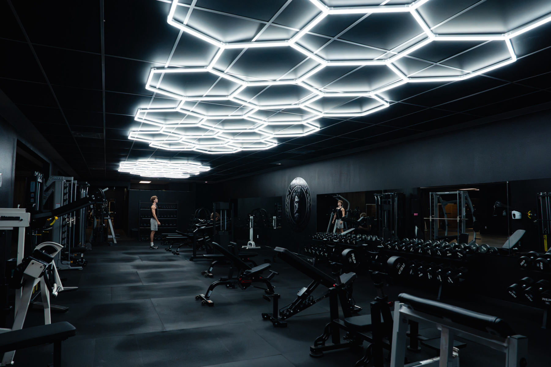 The Forum's main training floor in Fayetteville, Arkansas, lit by hexagon LED lighting