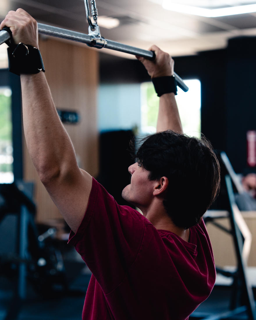 A member training on the cable machines at The Forum
